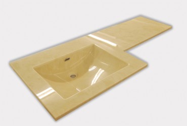 Cream marble vanity top with square integral bowl.