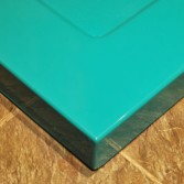 Bright peacock blue shower tray with textured base