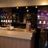 Purple sparkle high gloss decorative panels by Versital with bar in front.