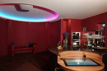 Games room with bar area in brown marble.