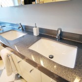 Silver vanity top with 2 white basins.