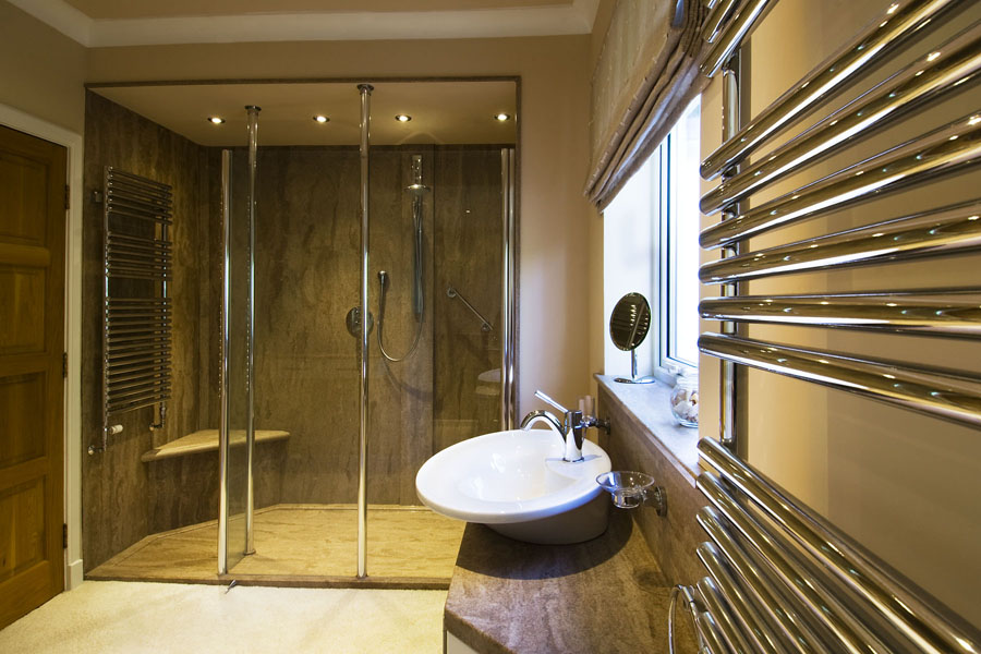 bathroom design  using Versital sandstone marble finish shower panels and bespoke shower tray