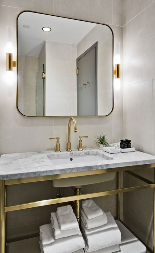 Grey marble bathroom vanity with brass accents inspiration from 11Howard.com