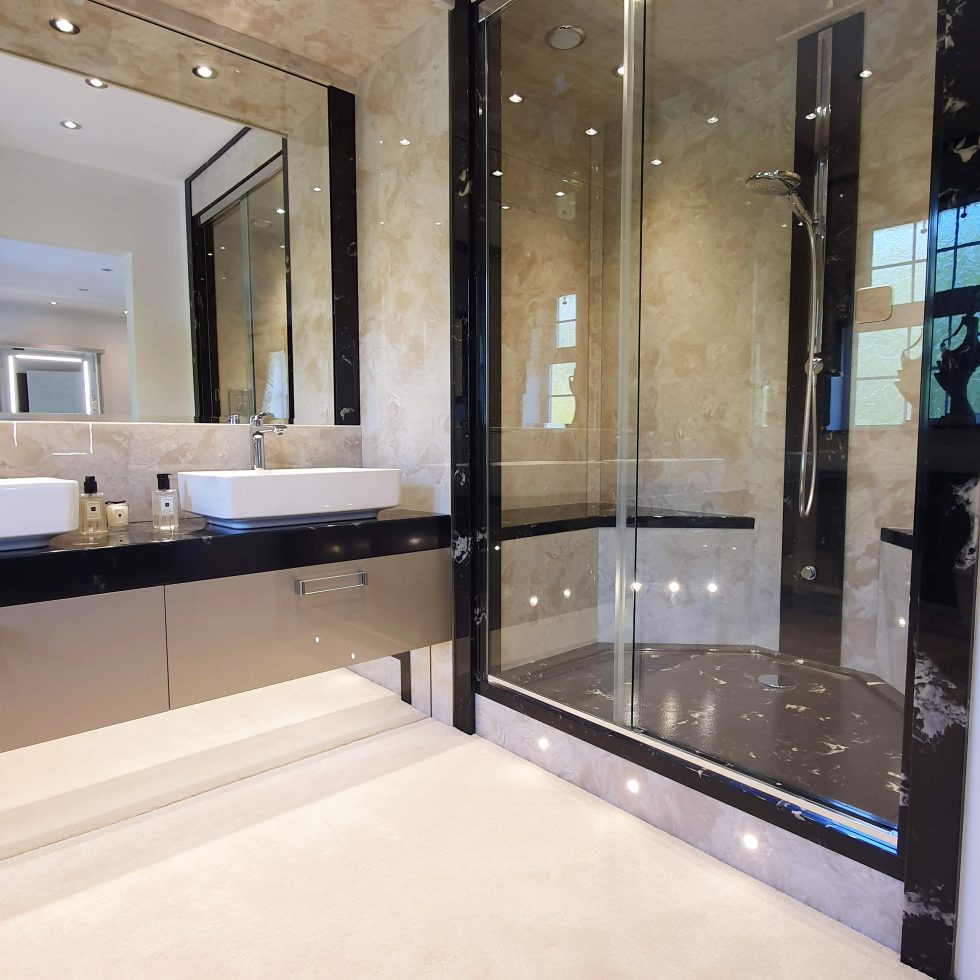 Walk in shower with hotel style built in seats and spot lights.