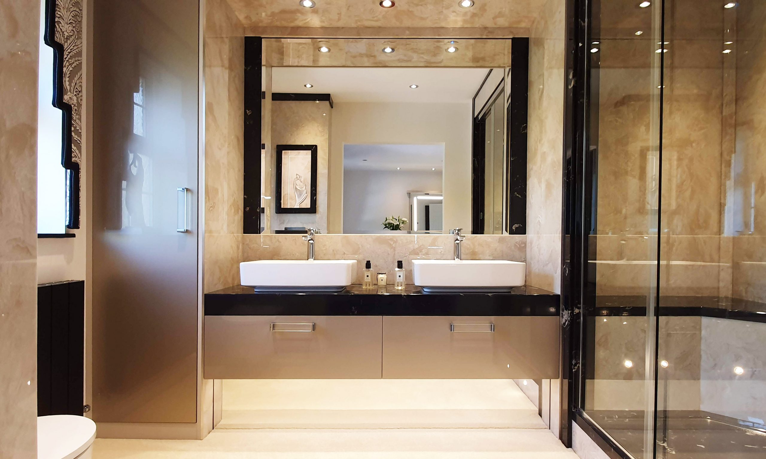 Twin bathroom with cream sparkle cabinets and top mounted basins