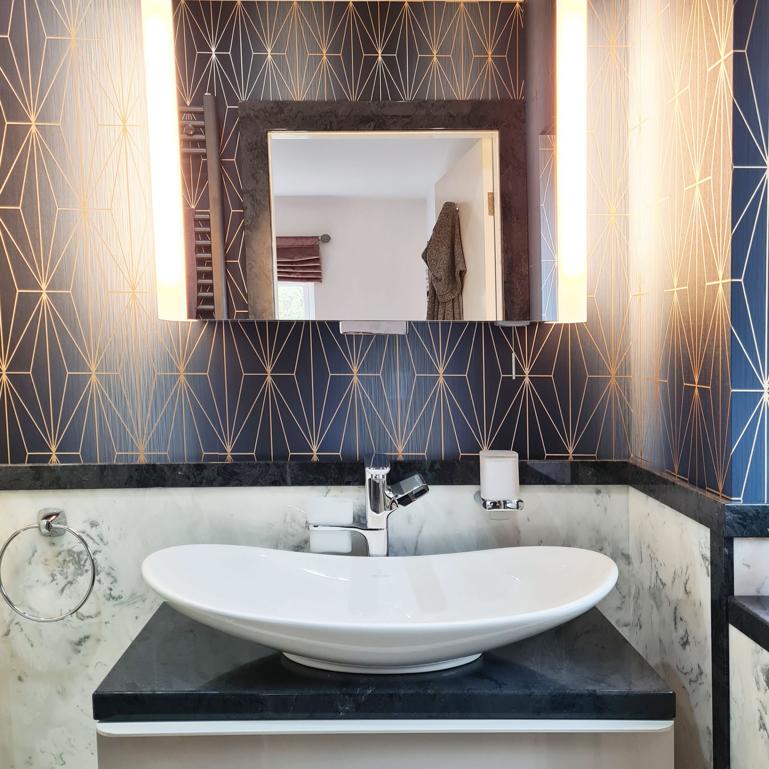 Bathroom design with Navy blue and gold geo wallpaper