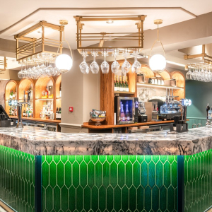Modern bar with green tile front and cultured marble top