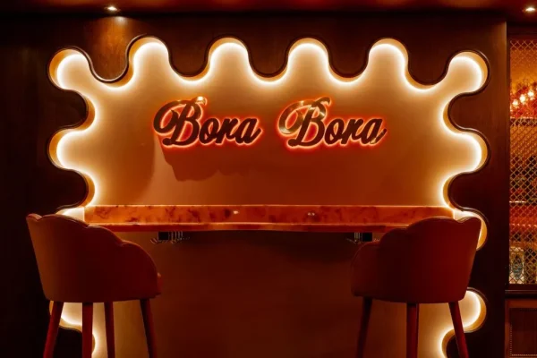 Bora Bora red and pink retro inspired bar with pink marble table tops and bar