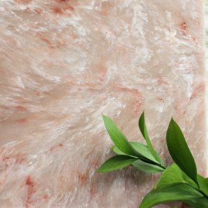 Rosewood Mist is a beautiful nude and pink marble with swirls of white and brick red veins. Part of the Versital Eco range.