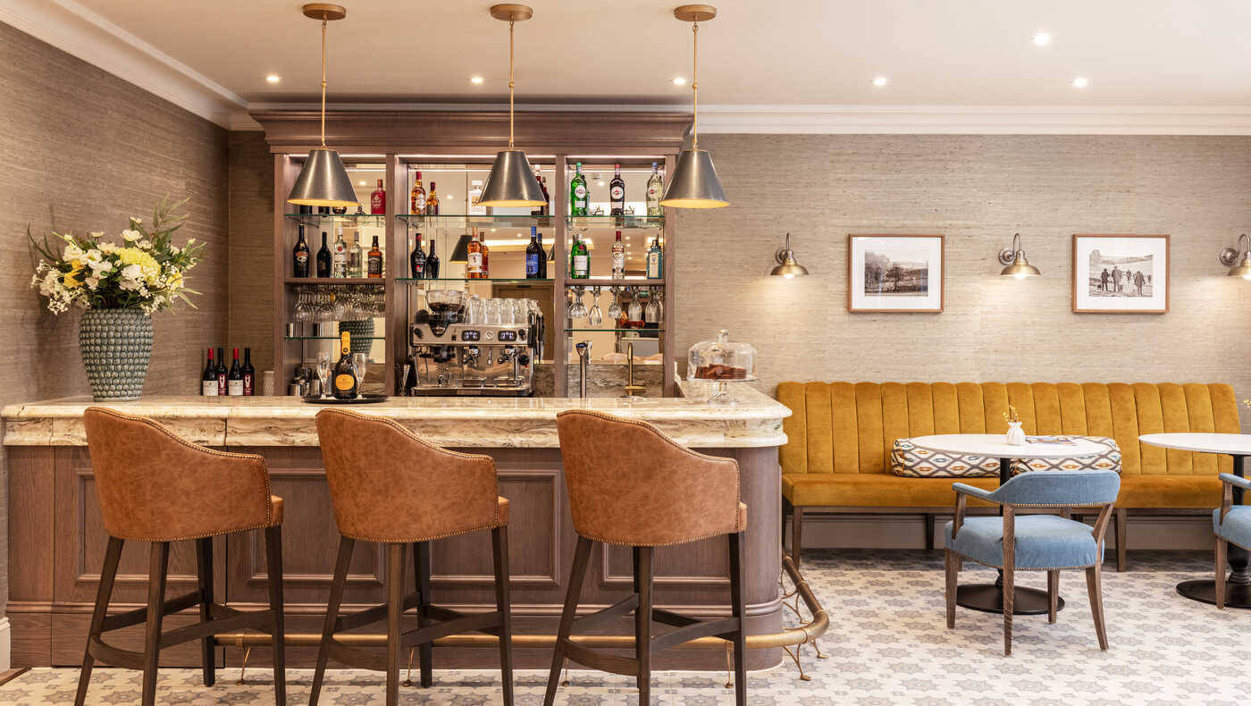 Roundhay Care home bar area and lounge. Bar area in Pistachio marble from Versital with DD drop edge detail
