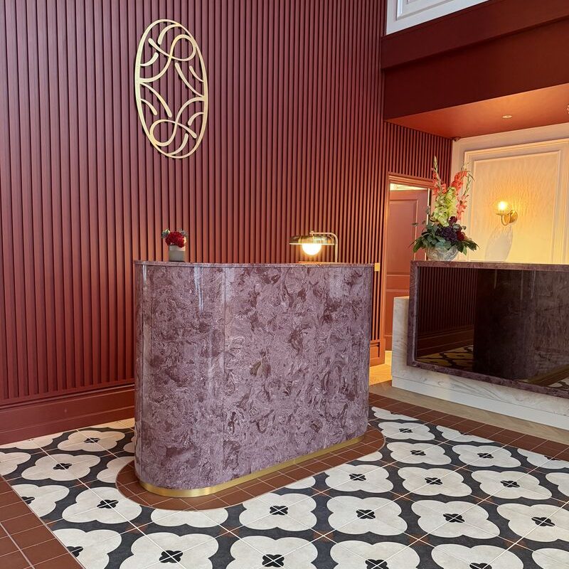 Reception desk meet and greet podium in rich Burgundy marble Rocco